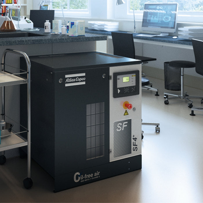 An atlas copco scroll compressor situated in a lab environment