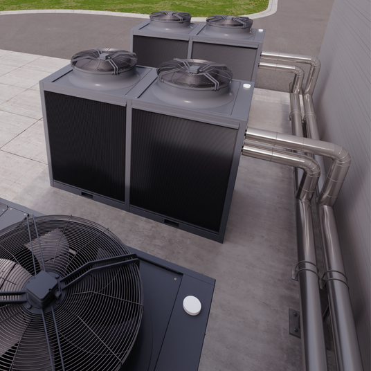 Atlas Copco industrial chiller external picture showing the back of three units and the pipes and ducting